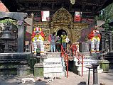 
Kathmandu Valley Sankhu Vajrayogini Temple Entrance With Two White Snow Lions, Bells and Torana Door
